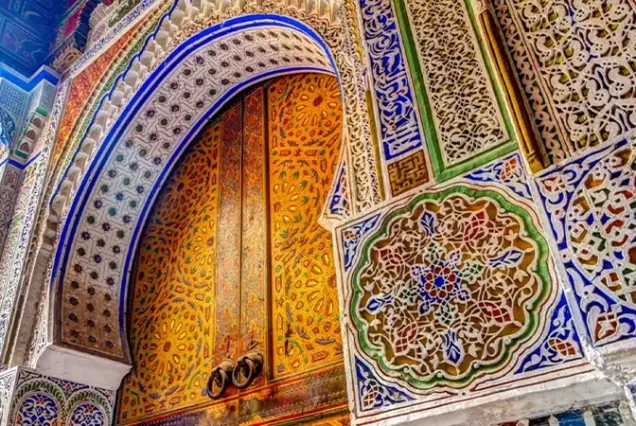 A colorful and intricately patterned door showcasing traditional architecture in the Medina of Fes el Bali.