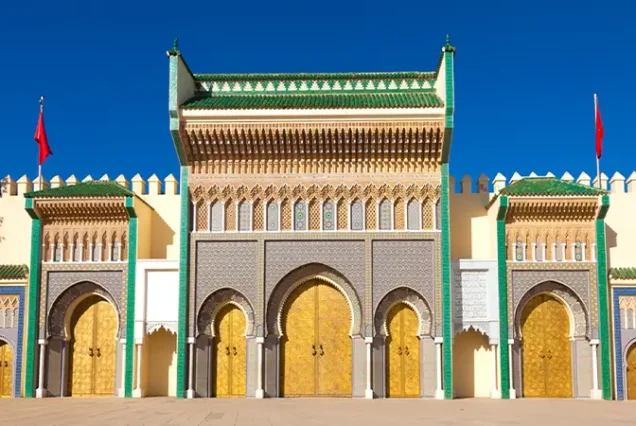 Stunning gates of Dar el Makhzen, the Royal Palace in Fes, Morocco, displaying ornate and colorful craftsmanship.
