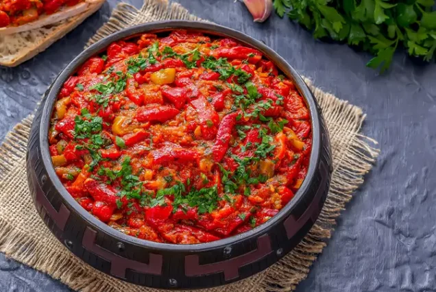 A traditional Moroccan vegetable dish called Taktouka, made of bell peppers and tomatoes, beautifully presented.